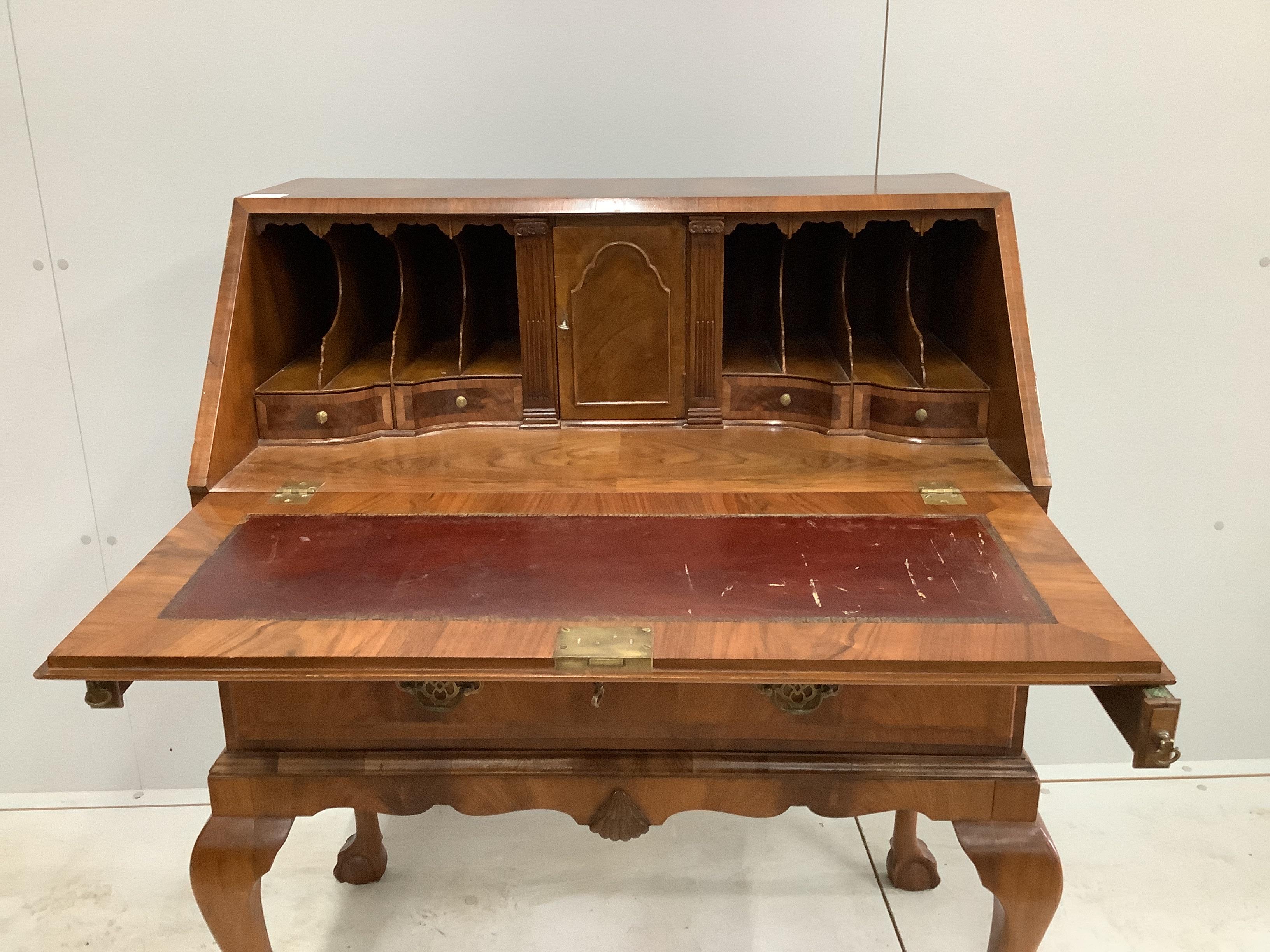 A Queen Anne revival feather banded walnut bureau, width 82cm, depth 49cm, height 105cm